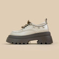 Amy And Mai white platform Mary Jane shoes with chunky 6-8cm heel and front lace-up.