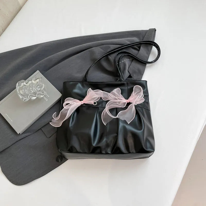 College style bow tote bag in PU leather with double shoulder straps and internal zipper organiser