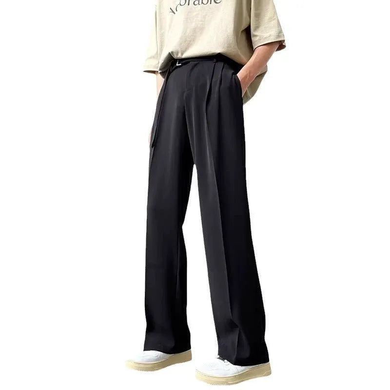 Women's black wide leg straight cut trousers with a non-iron finish on a neutral background