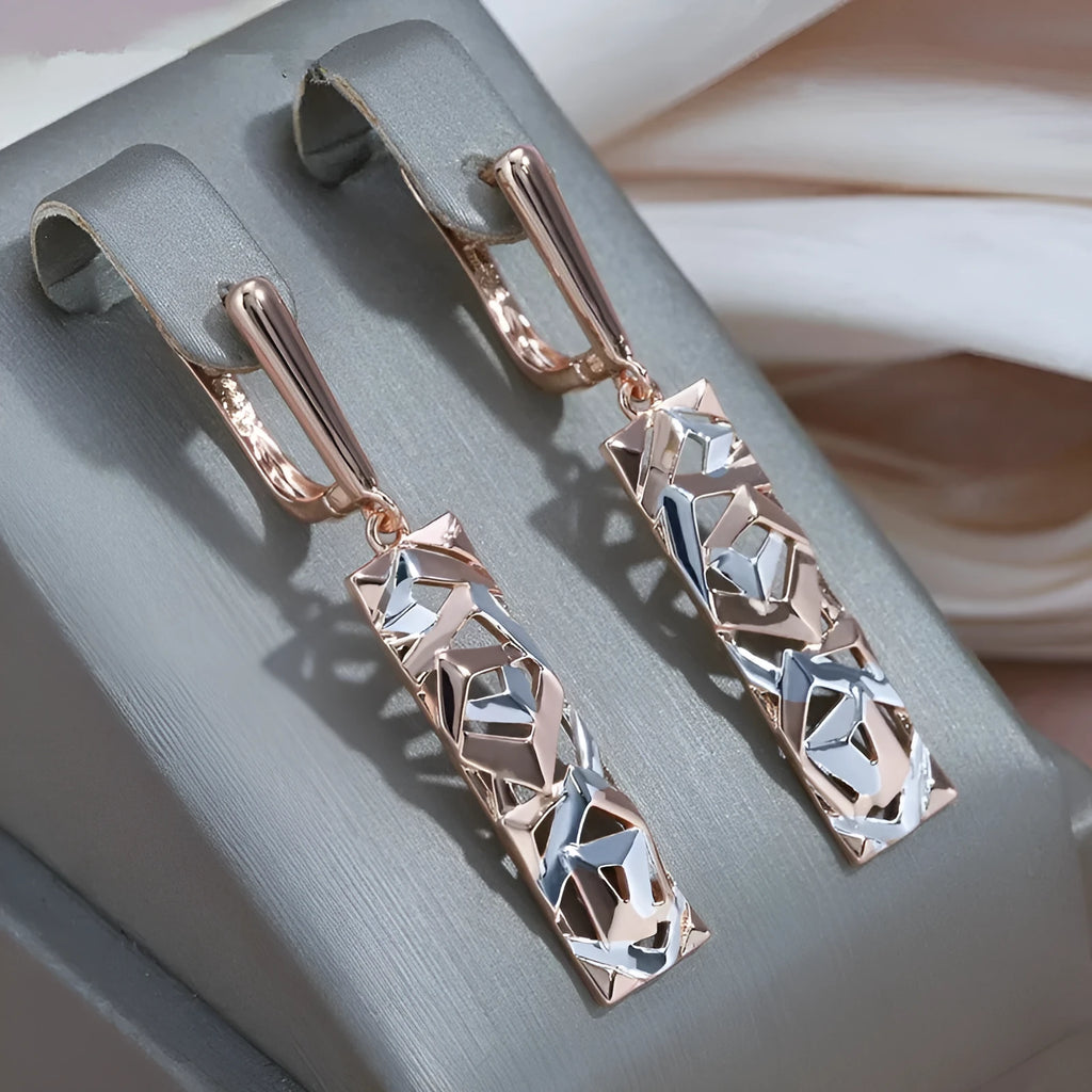 Rectangular two-tone hollow geometric alloy stud earrings for women with electroplated finish.