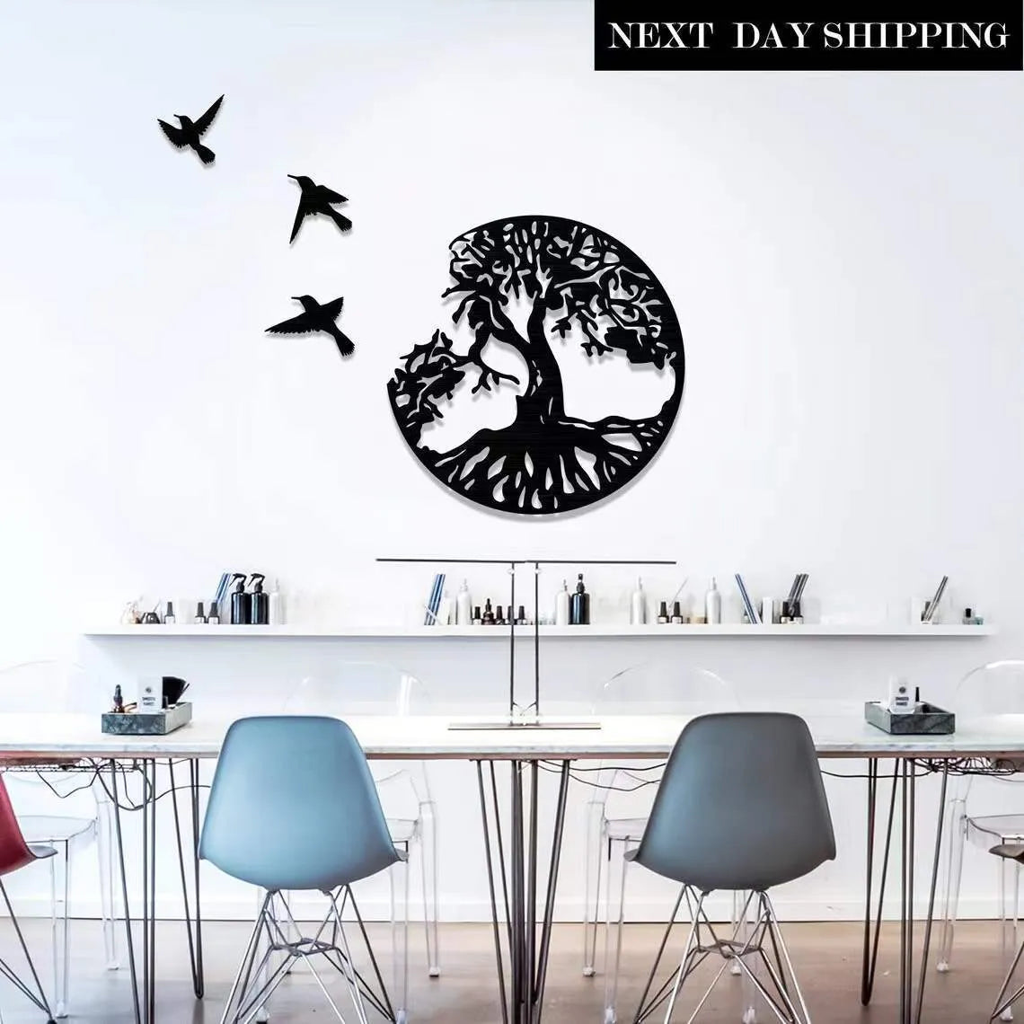 Black electroplated iron wall hanging ornament with modern simple design, shown with included hanging strap