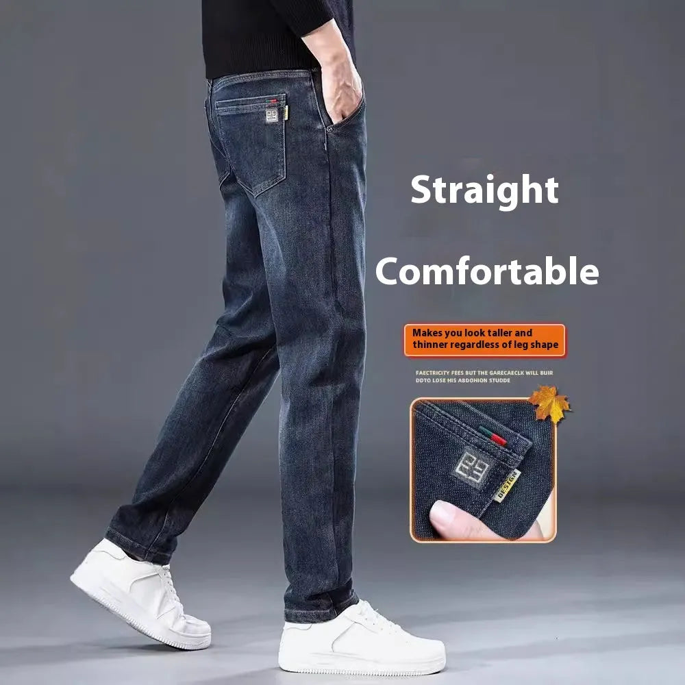 Man wearing slim straight blue grey casual trousers with a zip fly and mid waist.