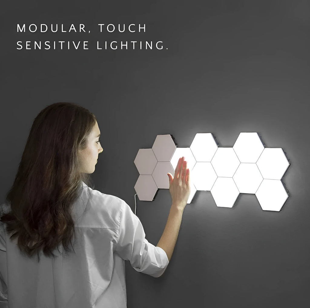Helios modular honeycomb touch-sensitive wall lamp panels assembled in a geometric pattern on a wall.