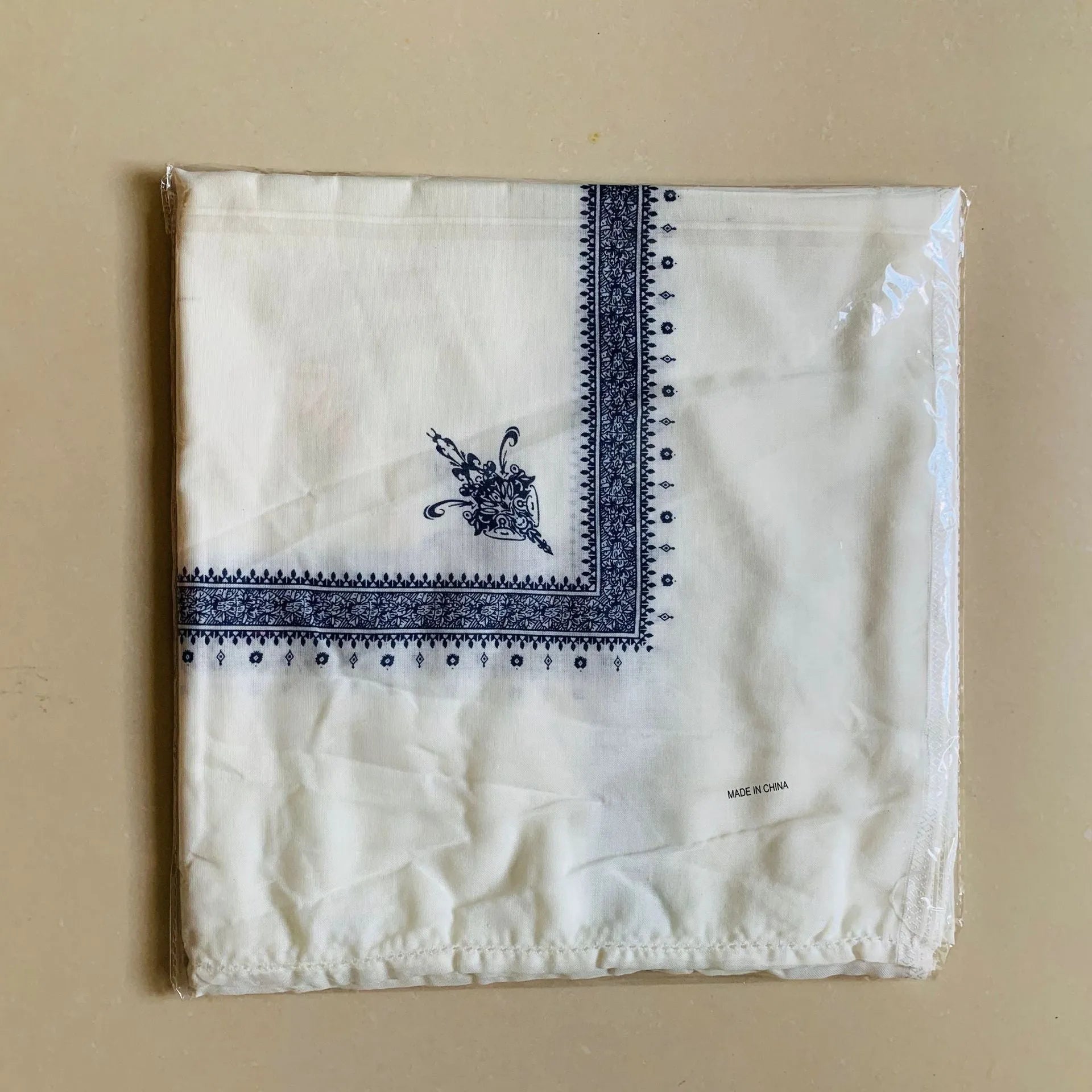 Printed square polyester scarf in a selection of colours, shown flat to display its 138x138 cm dimensions.