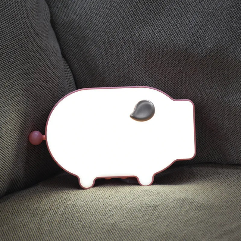 Blue digital LED alarm clock showing time and temperature on display with USB cable