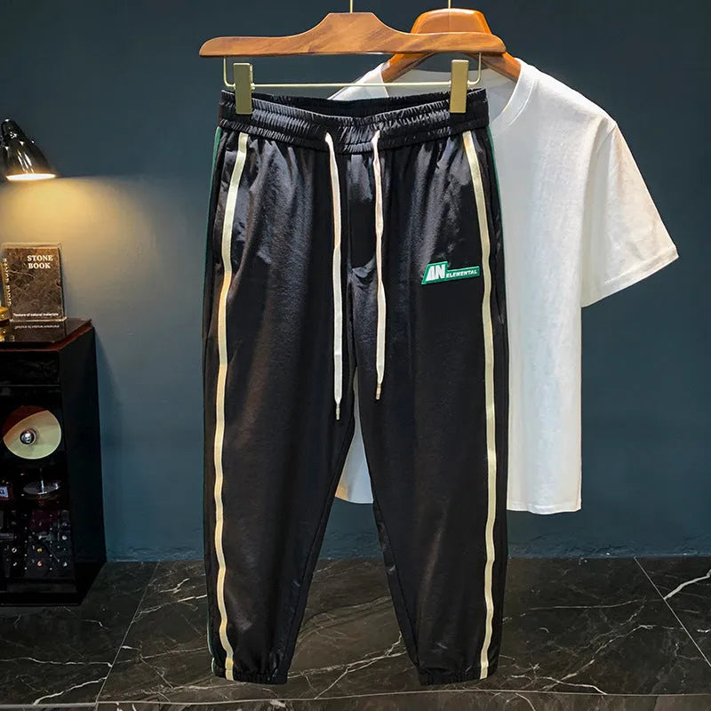 Men's black cotton harem pants with elastic waistband and full-length trousers