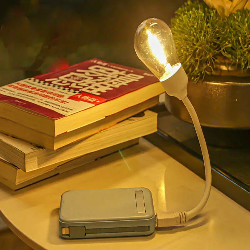 USB rechargeable folding tungsten night light with S14 bulb showing warm 2700K illumination