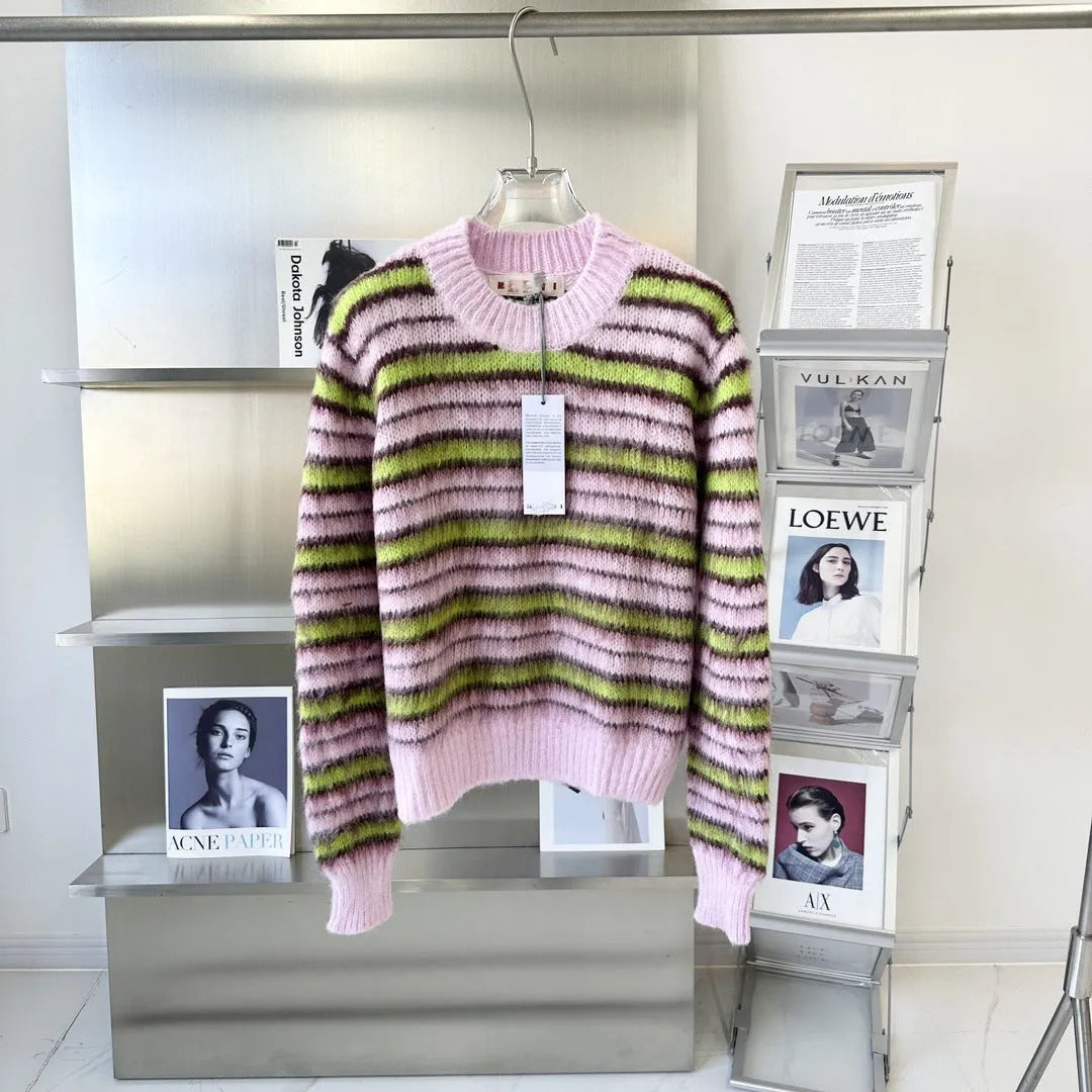 Pink wool lazy coat Haima cardigan sweater with nap craft texture on a hanger.