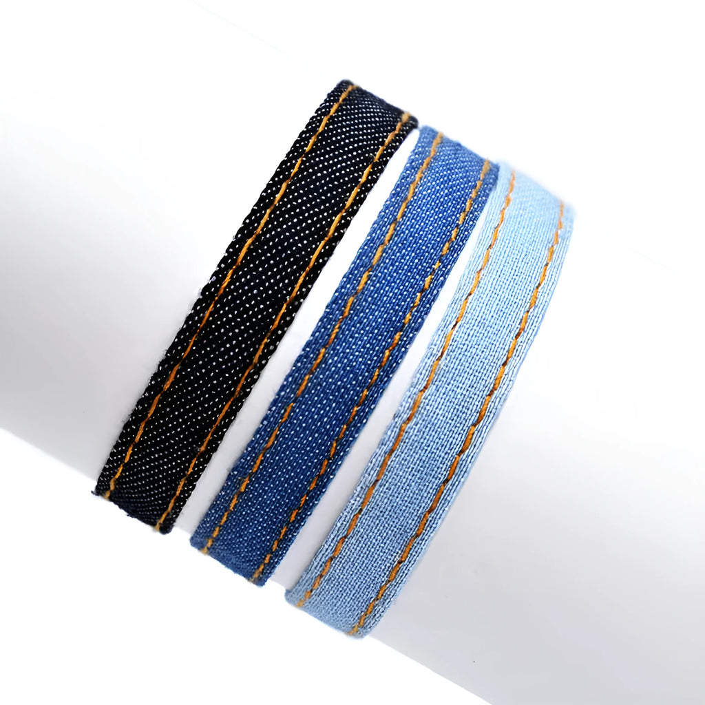 Denim fabric bracelet carrying strap with mixed materials and unisex design