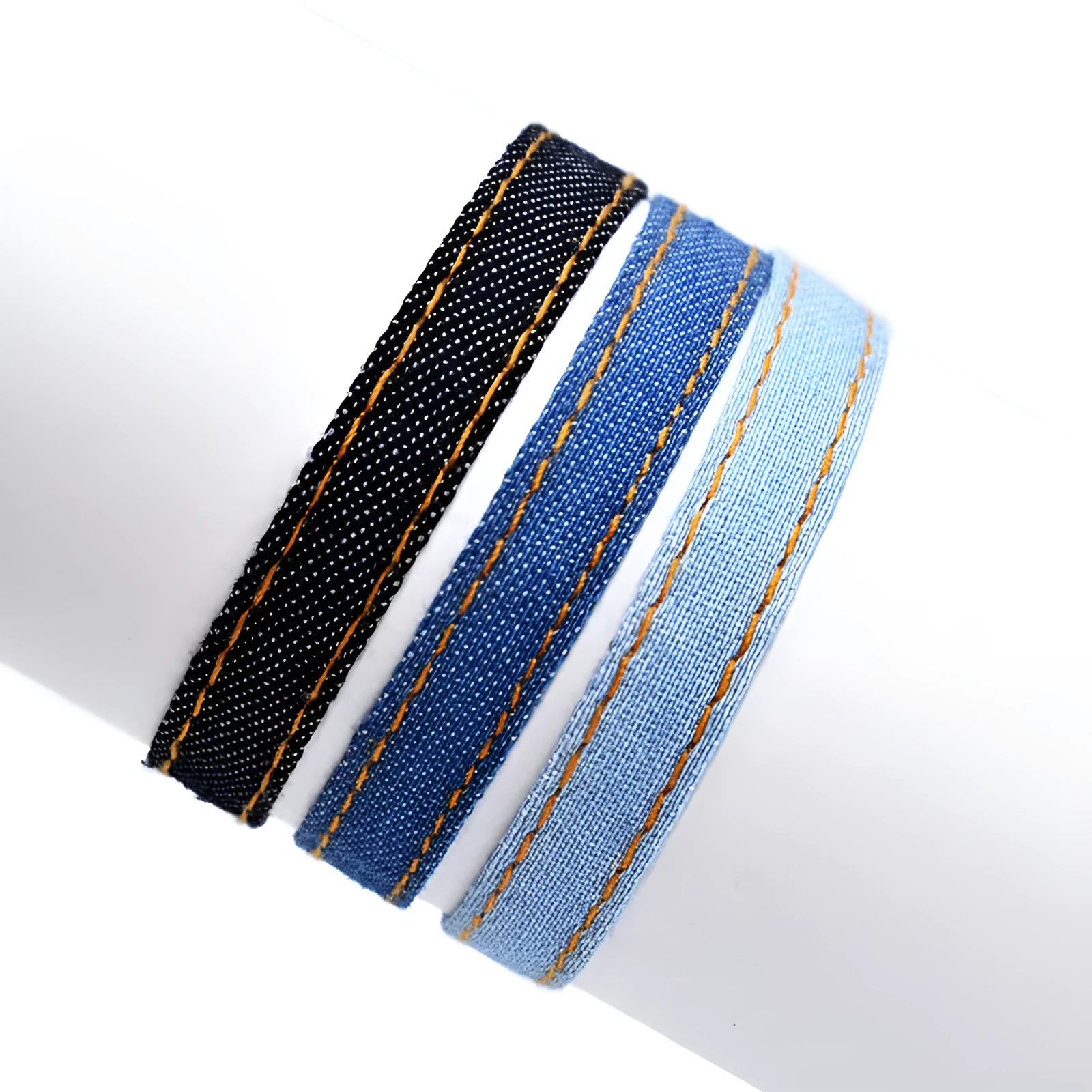 Denim fabric bracelet carrying strap with mixed materials and unisex design