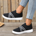 Black women's flat shoes with flyknit mesh upper, round toe and tassel detail