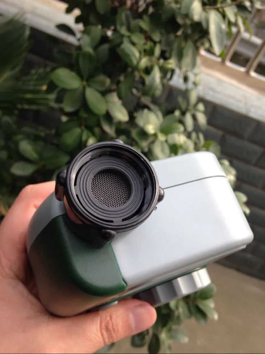 Green digital garden hose timer with large LCD screen and two outlet valves