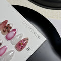 Hand-painted three-dimensional carved nail beauty patches in candy colours on an almond-shaped nail.