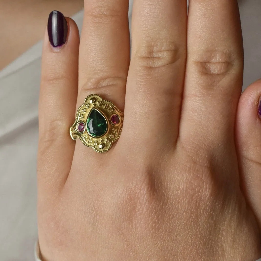 Women's gold-plated geometric ring with electroplated finish showing golden lvzuan colour
