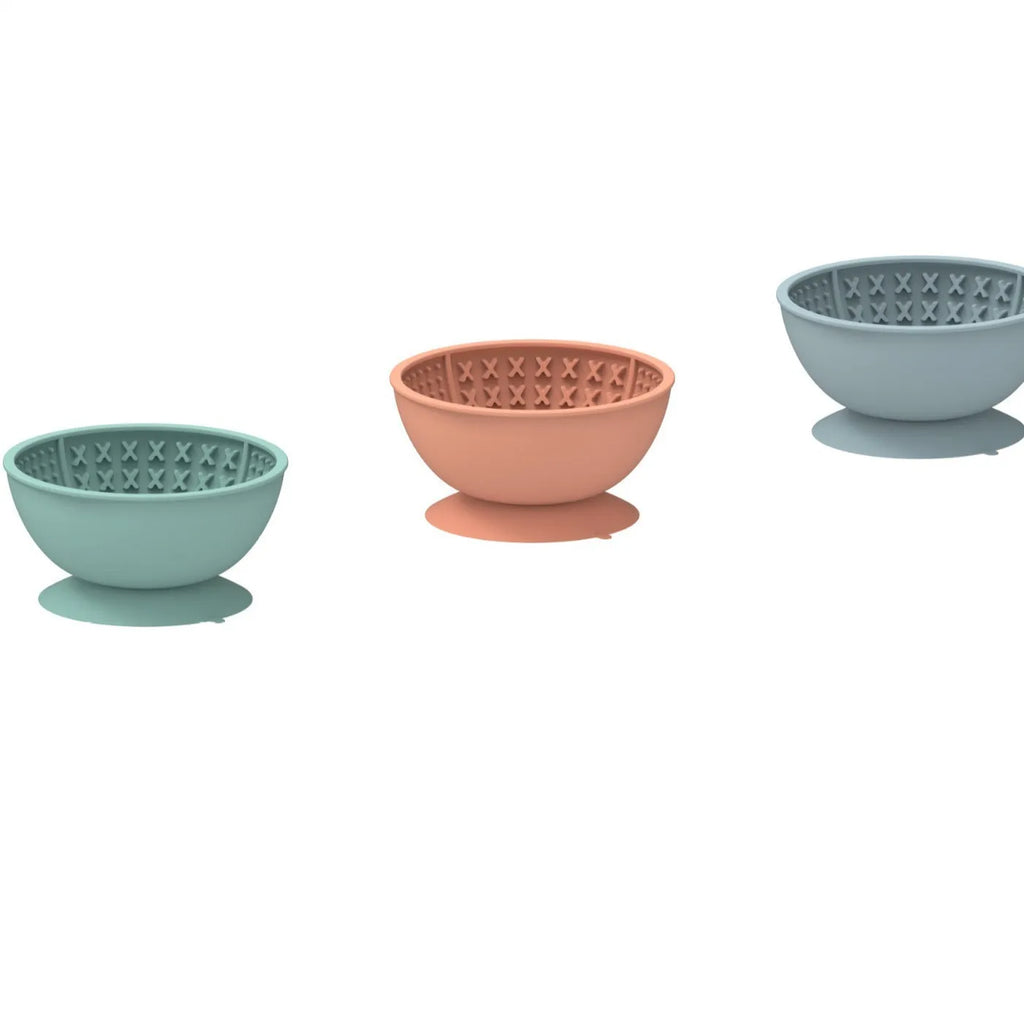 Cyan silicone pet licking mat slow feeding bowl with suction cup base, textured surface patterns