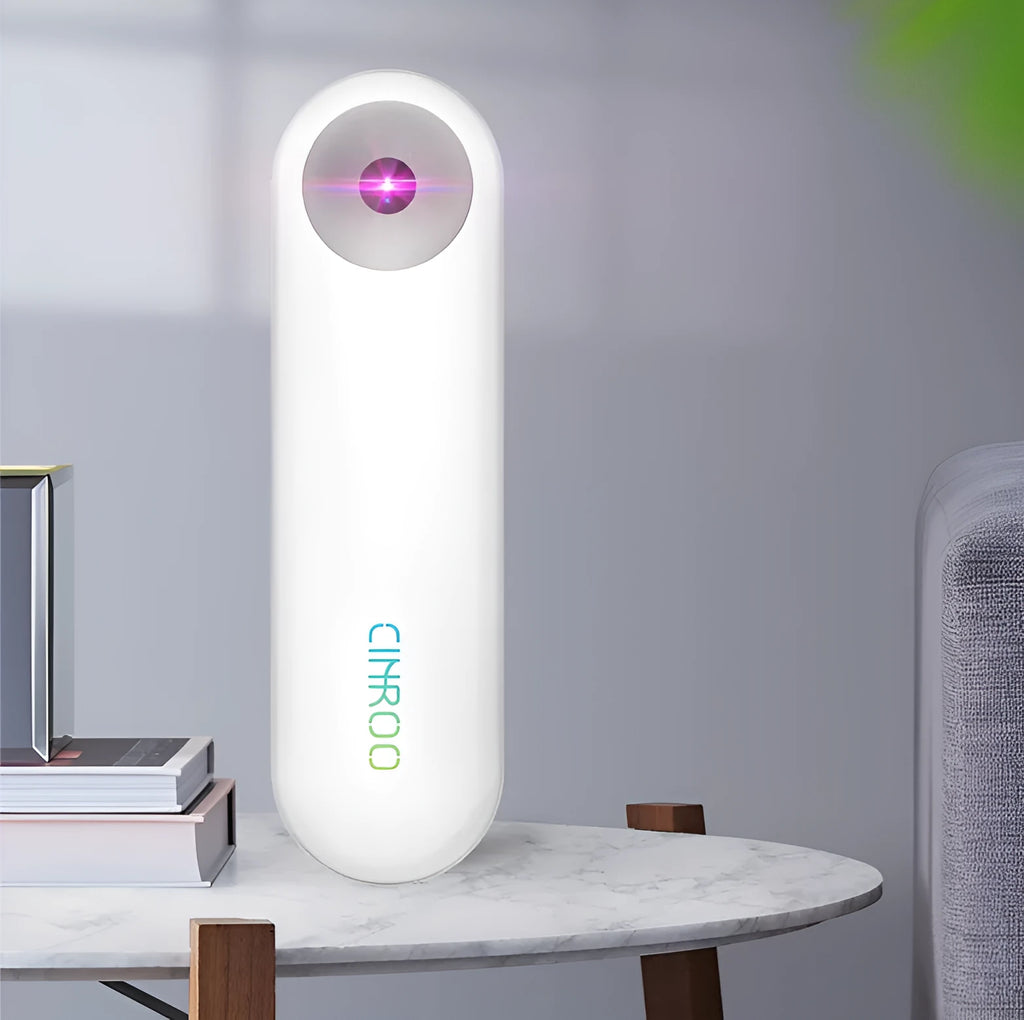 White portable UV-C sterilizer disinfection lamp showing compact handheld design