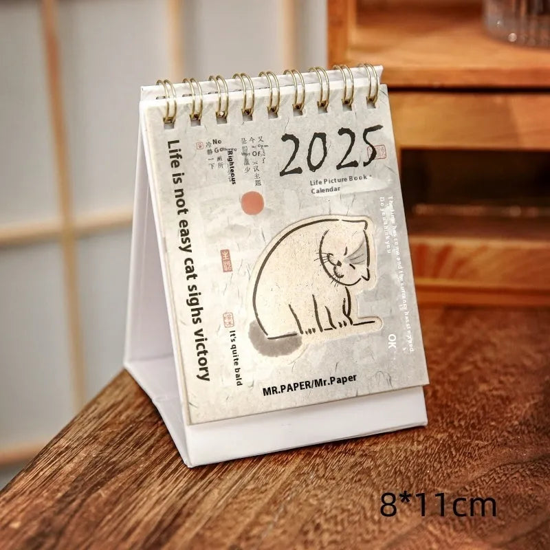 Mini 2025 desk calendar showing multiple design options including Coffee Time and Life Is Not Easy themes