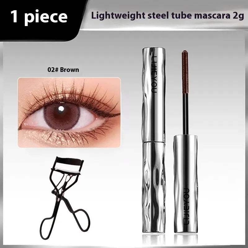 Waterproof long thick mascara in a steel tube with black and brown colour options, shown with an eyelash curler.