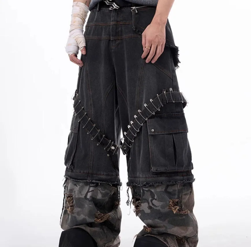Grey camouflage men's jeans with panel splicing construction and ribbon detailing.