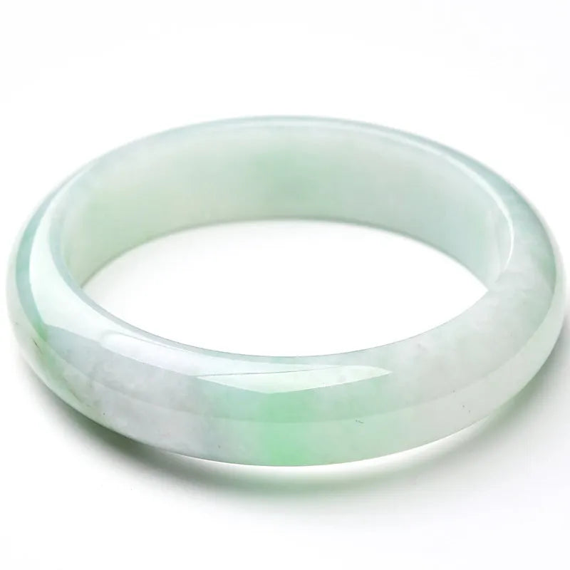 Light green jade bracelet with natural style design on wrist