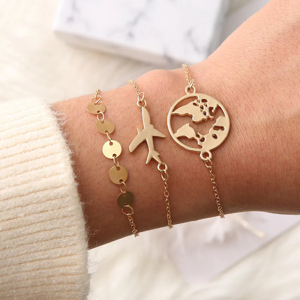 Three bohemian bracelets with alloy aircraft map heart charms in electroplated finish