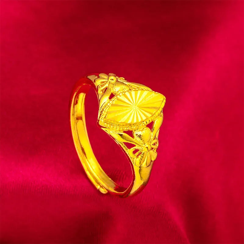 Geometric brass flower ring with gold electroplated finish showing textured diamond design