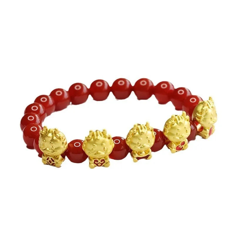 Natural red agate bead bracelet with a detailed five blessings dragon charm on a white background.