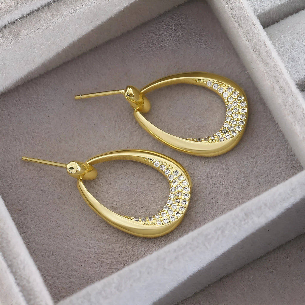 Yellow gold geometric drop earrings with ring design elements measuring 2.6cm