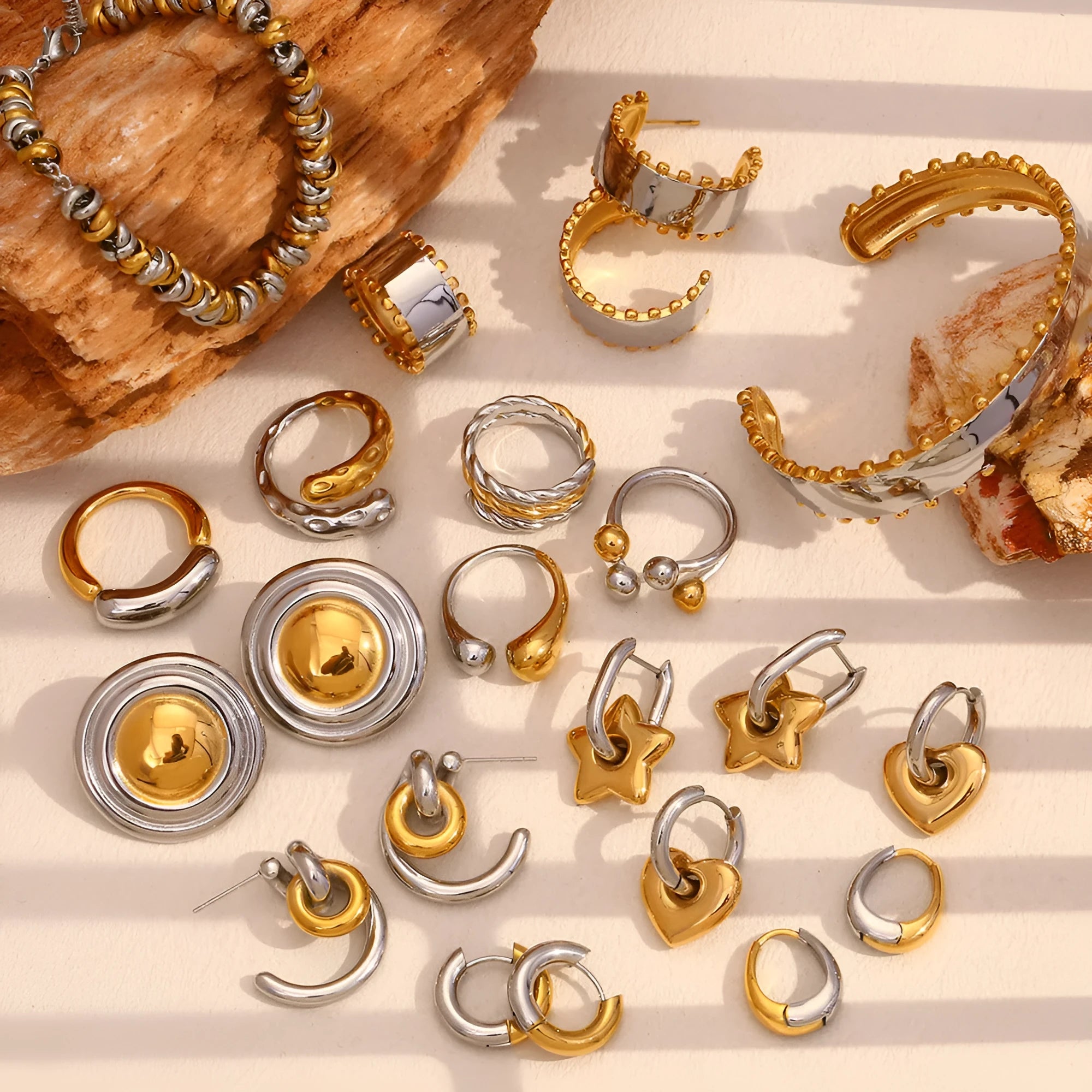 Gold electroplated geometric jewellery set with earrings, bracelet and necklace on stainless steel