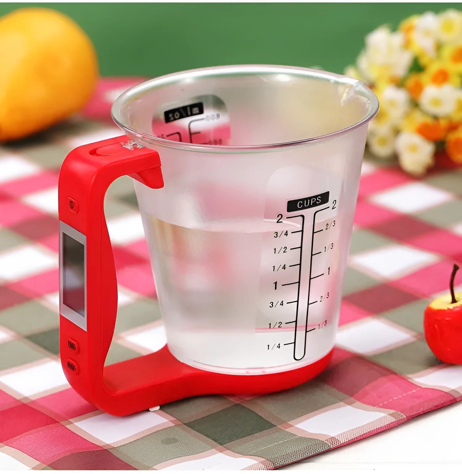 Green electronic digital measuring cup with LCD display on handle showing weight measurement.