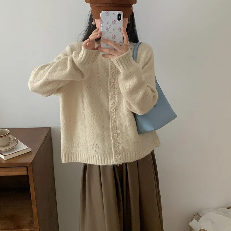 Women's loose artistic retro cardigan sweater coat in light grey viscose fibre, shown open as a layering piece.