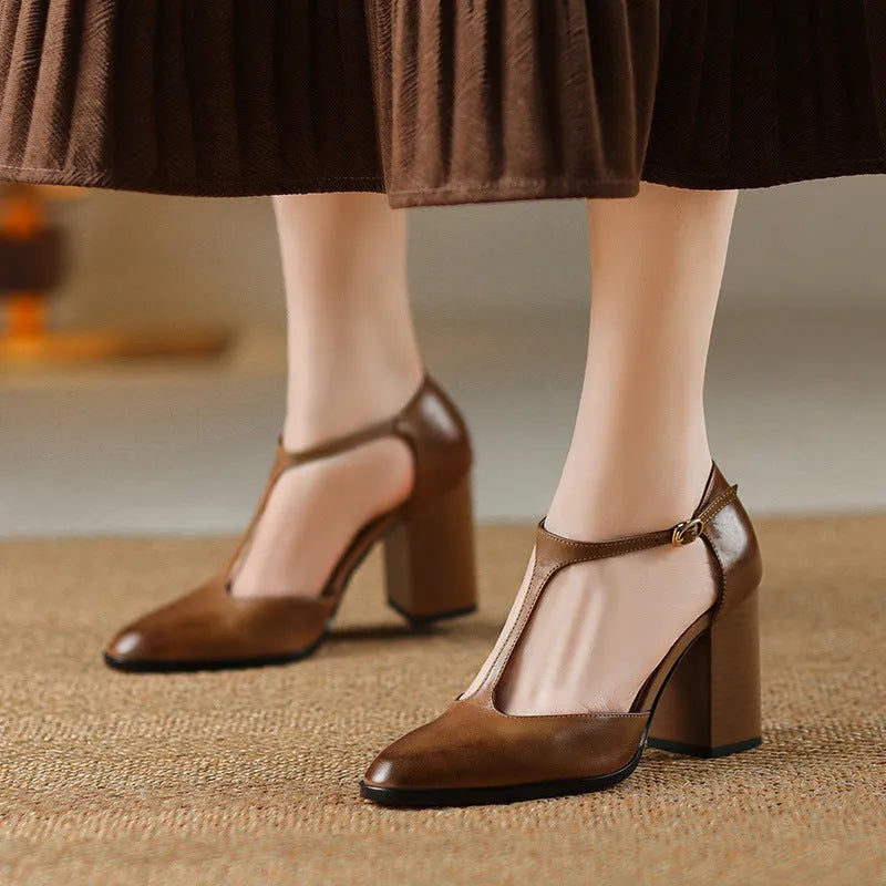 Baotou hollow-cut retro Mary Jane shoes in dark brown with pointed toe and buckle fastening.