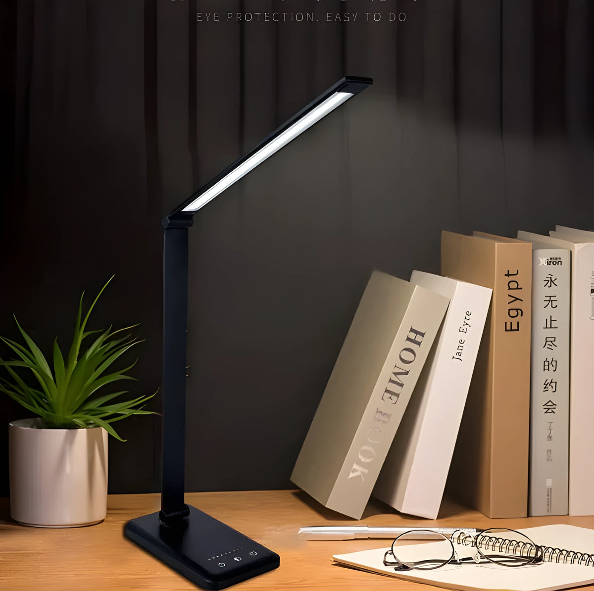 Wireless charging LED desk lamp with foldable design and USB port, shown in black.