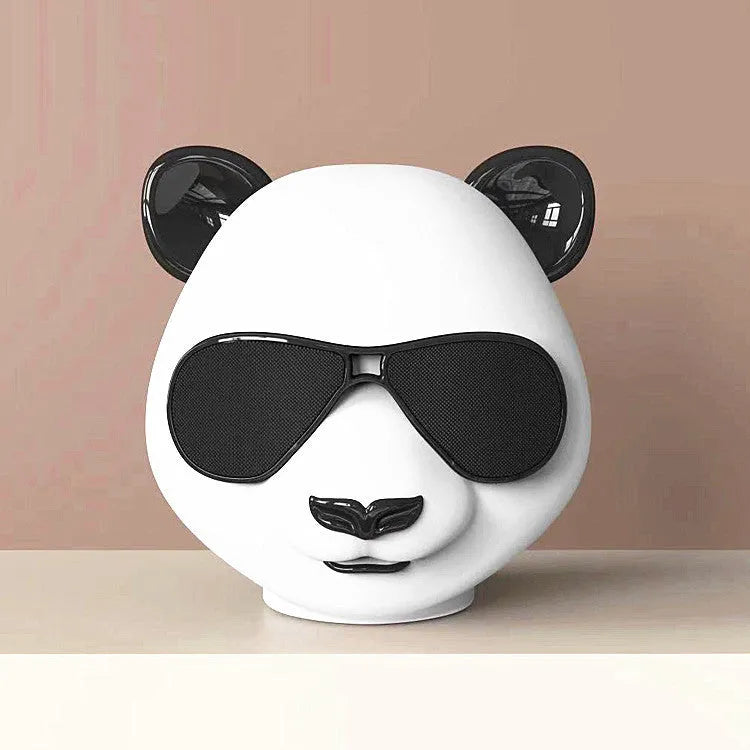 Classic style portable mini Bluetooth speaker showing front grille and likely a USB charging port.
