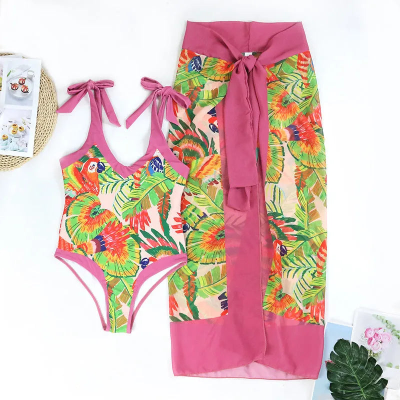 Pink floral print retro women's one-piece swimsuit with V-neck and attached thin skirt