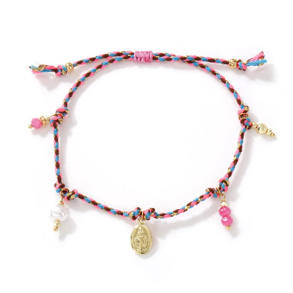 Close-up of a hand-woven colourful braided rope bracelet for women featuring an adjustable carrying strap tag closure.