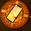 Square wireless phone charger with glowing magic array pattern showing 10W fast charging capability