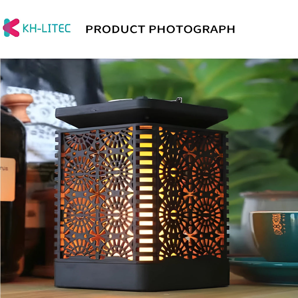 Four black solar-powered hanging torch lights with flickering flame LED effect for outdoor gardens.