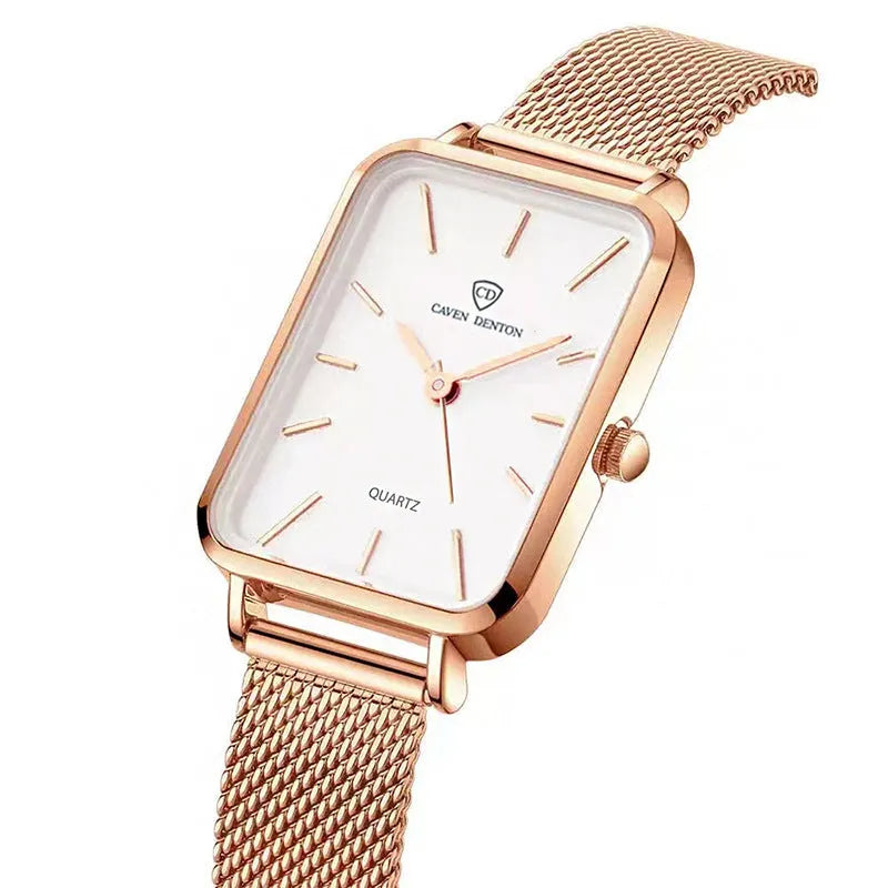 Rose gold women's waterproof quartz watch with woven steel strap on wrist.