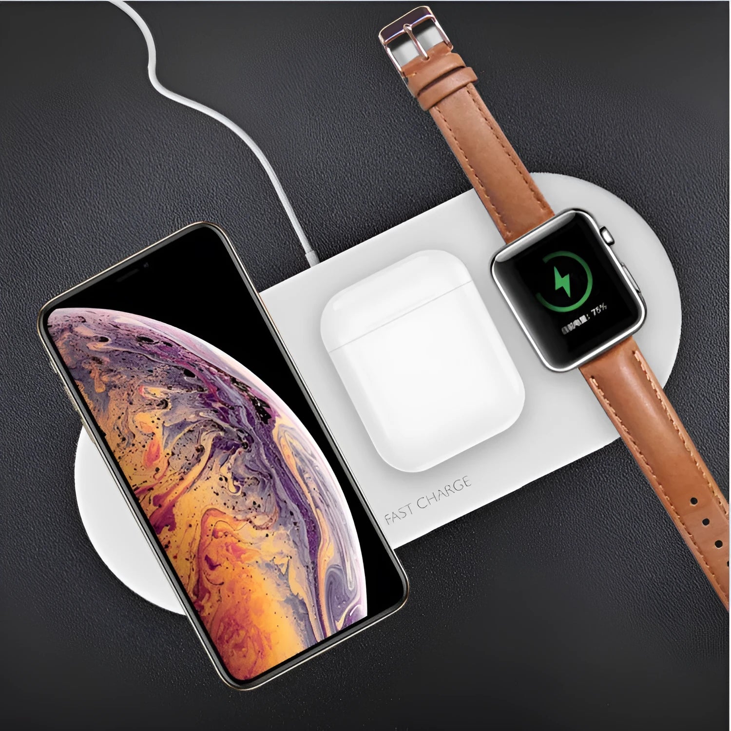 Black and white 3-in-1 wireless charging station for Apple-compatible phone, watch, and earbuds on a desk.