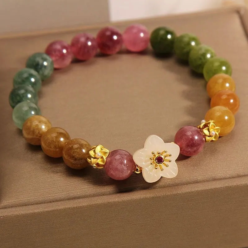 Natural colour tourmaline bracelet with floral and fu character designs on geometric casual jewellery