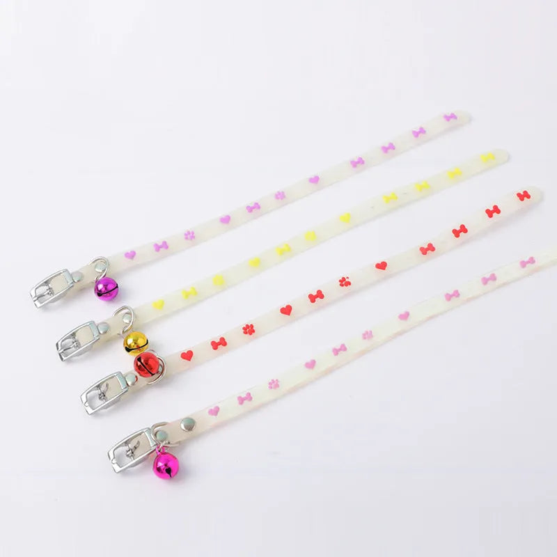 Cat luminous collar with adjustable silicone strap and metal bell showing paw print pattern