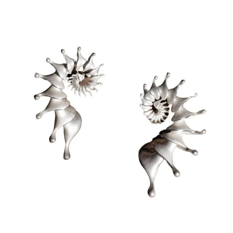 Conch coloured geometric stud earrings with three-dimensional matte finish