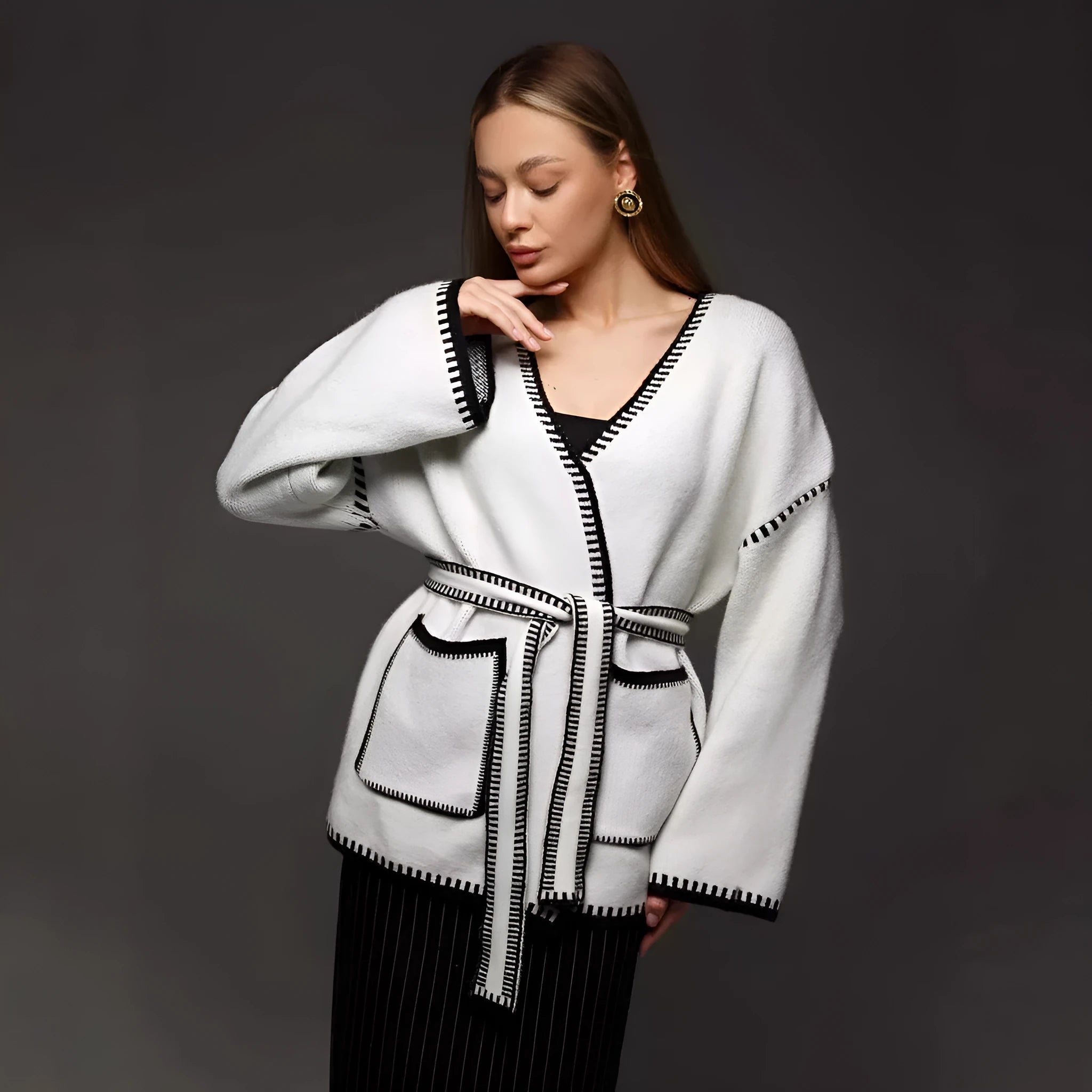 Loose fit knitted cardigan with lace-up front detail in thick imitation cashmere cotton fabric.
