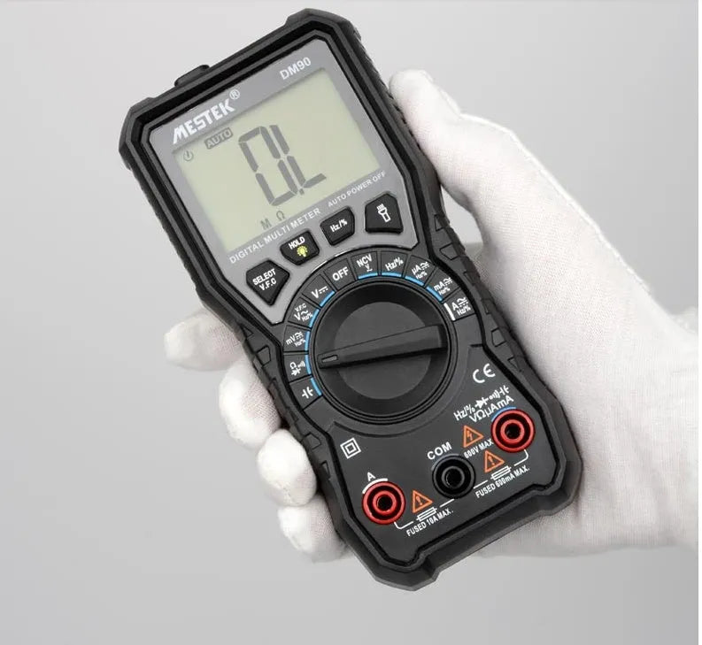 DM90A digital multimeter with display, test leads, and thermocouple for temperature measurement.