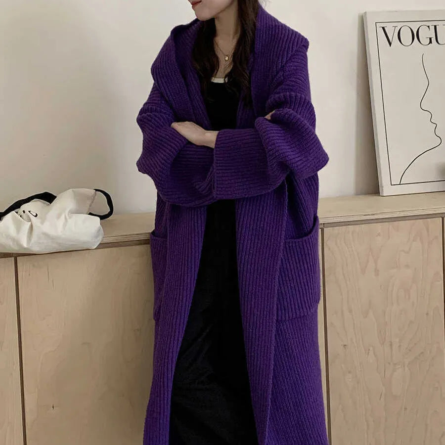Loose hooded cardigan coat with raglan sleeves in acrylic fabric showing extended length