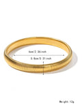 Women's vertical stripe ring titanium steel bracelet in gold and silver colours showing elastic construction.