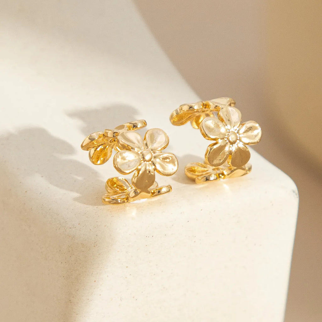 Gold starfish scallop eardrop earrings with conch design elements