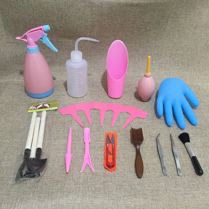 14-piece succulent gardening tool set showing mini shovels, tweezers, watering can, rake, and air blower on a table