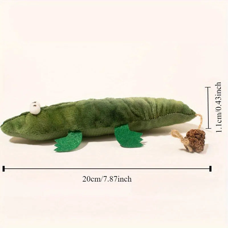Green plush alligator catnip toy with embroidered eyes and nose